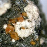 Calciohilairite, Kuzmenkoite-Mn