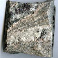 Aeschynite-(Nd), Ferriallanite-(Ce), Fluorite